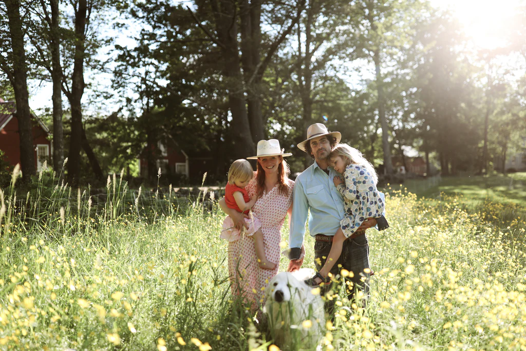 Family in a field with their dog