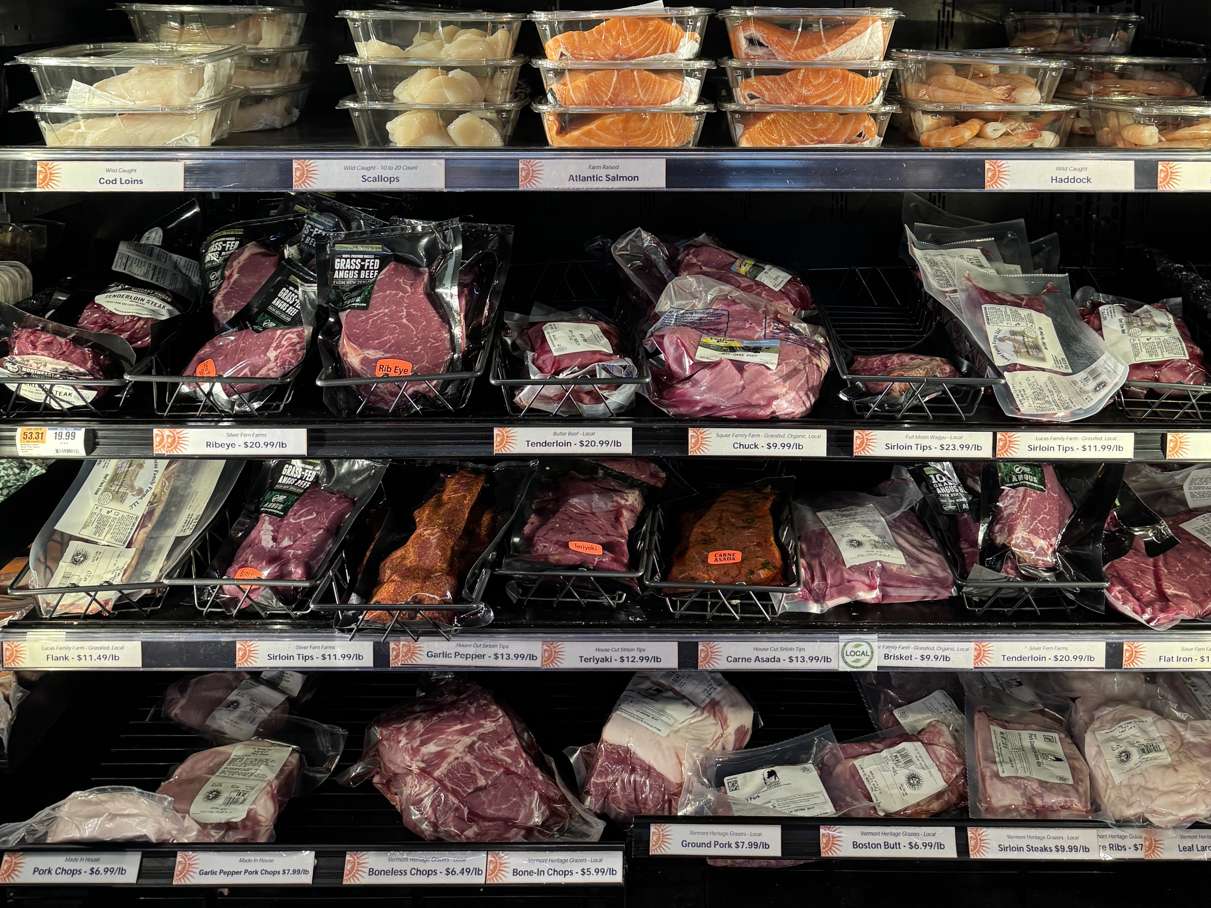 The inside of a meat and seafood refrigerator