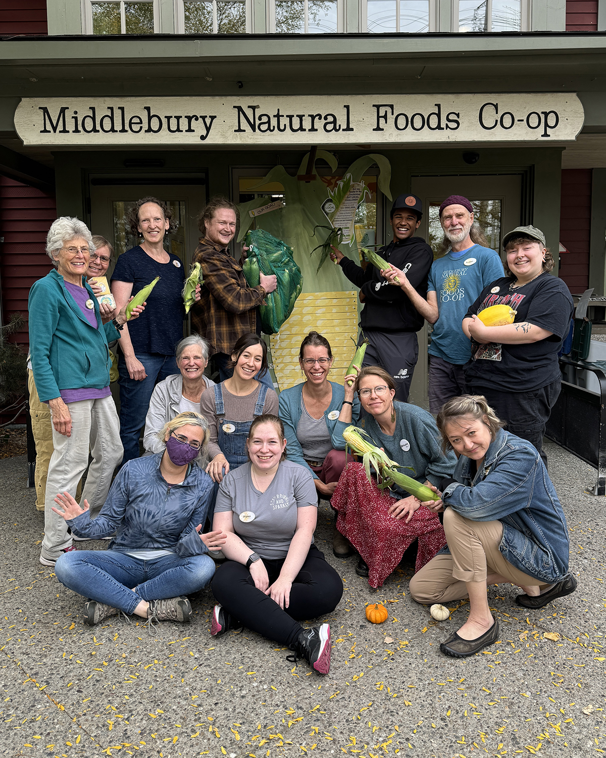 A group of staff members stands in front of Big Corn